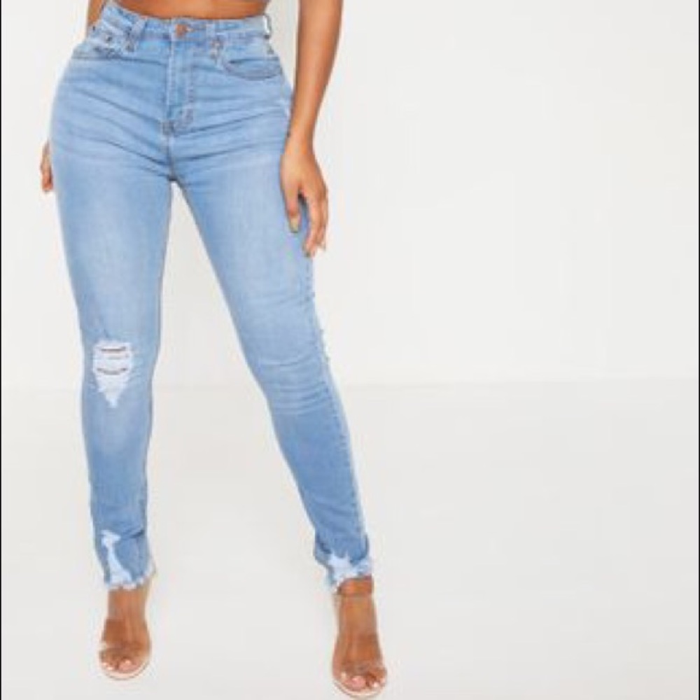 Prettylittlething high-waisted distressed jeans.